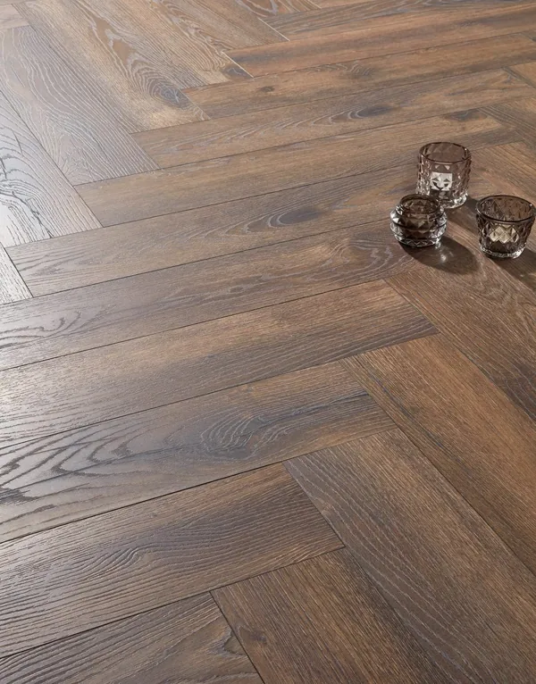 Close-up of dark oak herringbone floor planks