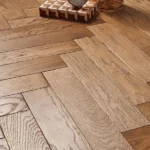Close-up of oak herringbone wood floor planks