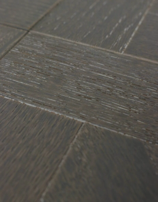 Detail of textured grey wood grain on tile.