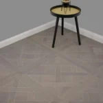 Grey Versailles tiles in room with side table.