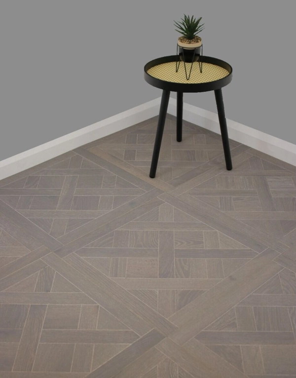 Grey Versailles tiles in room with side table.