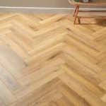 Light oak herringbone flooring in a modern room
