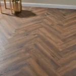 Oak herringbone flooring in a furnished room