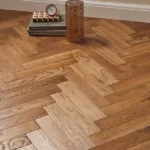 Oak herringbone parquet flooring with décor