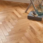Oak herringbone wood flooring in a modern room