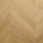 Top-down view of light oak chevron parquet