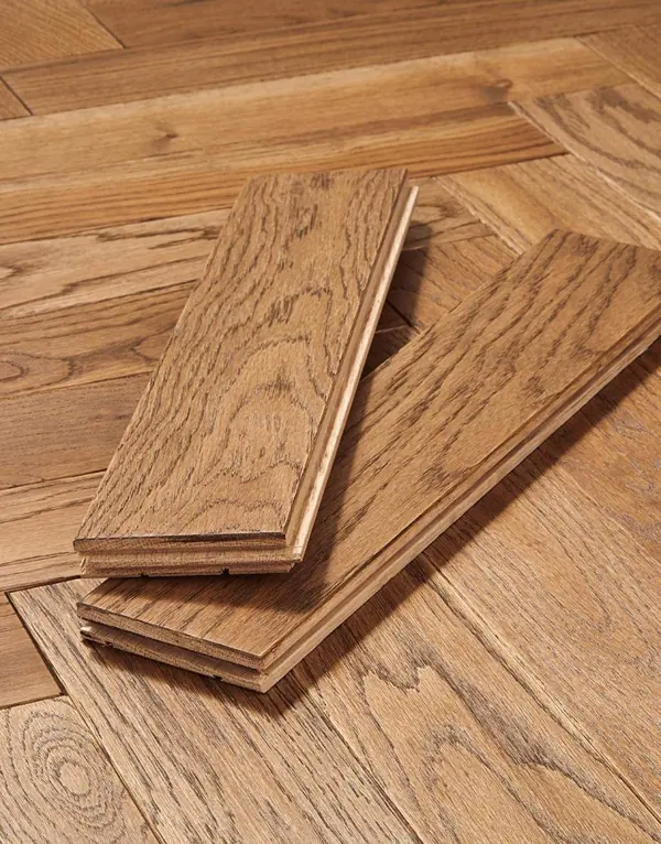 Two tongue and groove oak parquet flooring blocks