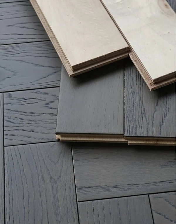 dark grey stained oak parquet flooring with a distinct herringbone layout