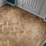 high-angle shot of a room with a classic Versailles parquet floor pattern in natural oak.