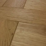interlaced geometric details of a natural oak Versailles parquet floor