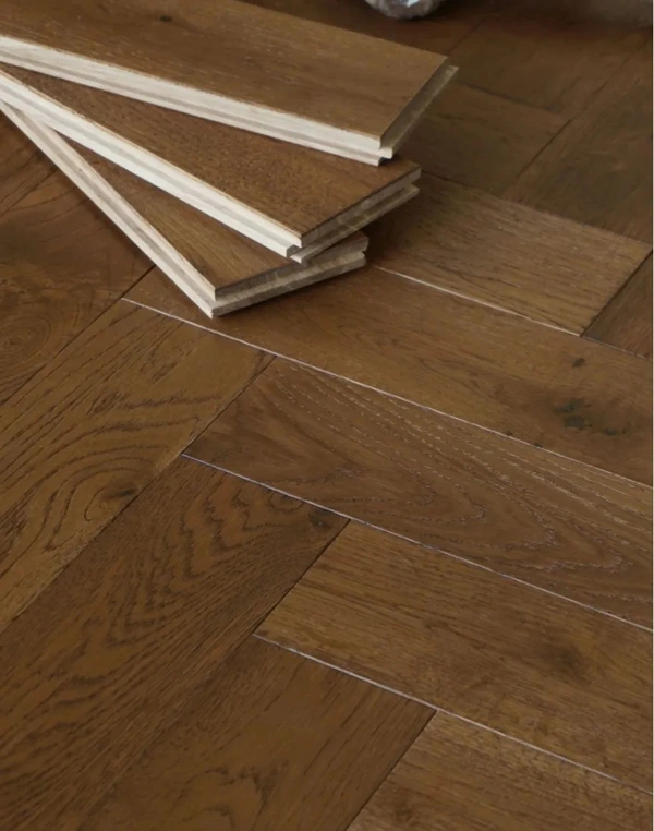 whisky oak parquet flooring in a classic herringbone pattern