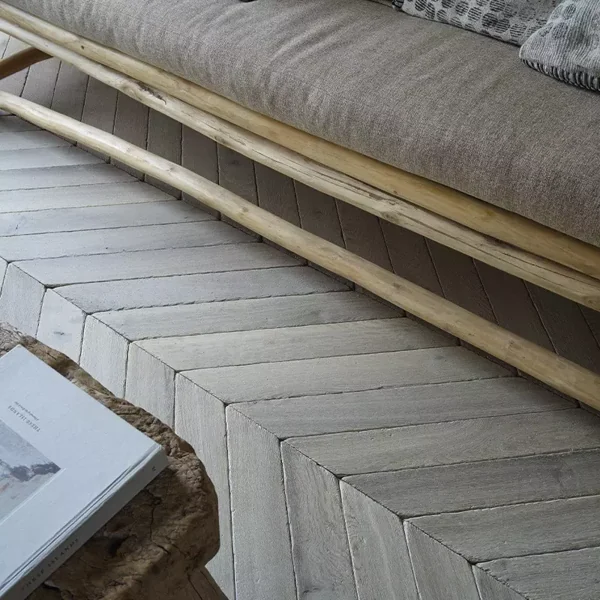 Chevron wood floor with rustic sofa bench