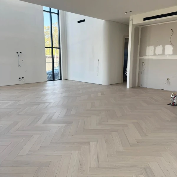 Light grey oak herringbone floor in modern open hall