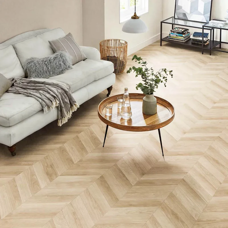 Light oak chevron flooring in a living room.