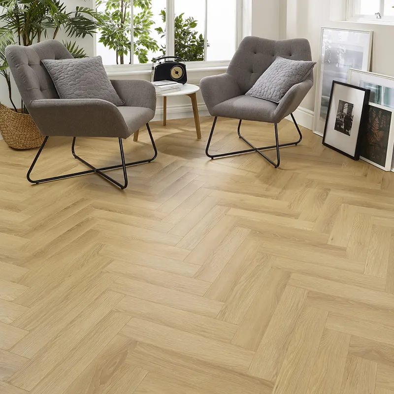 Light wood herringbone parquet flooring in modern kitchen