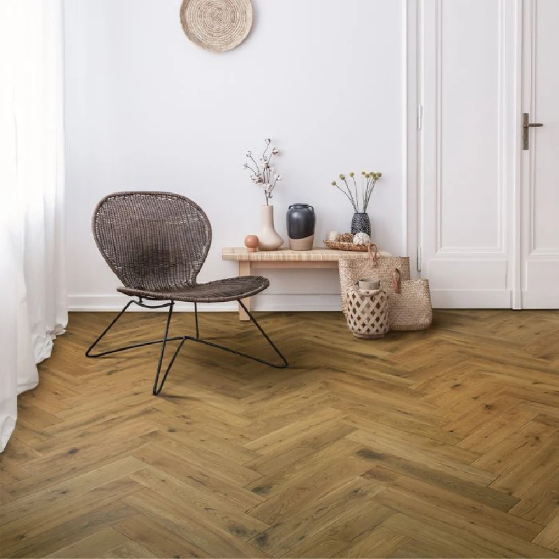 Natural distressed herringbone bamboo parquet flooring.