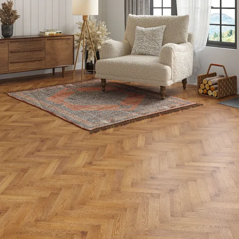 Warm oak herringbone wood flooring in spacious bright room
