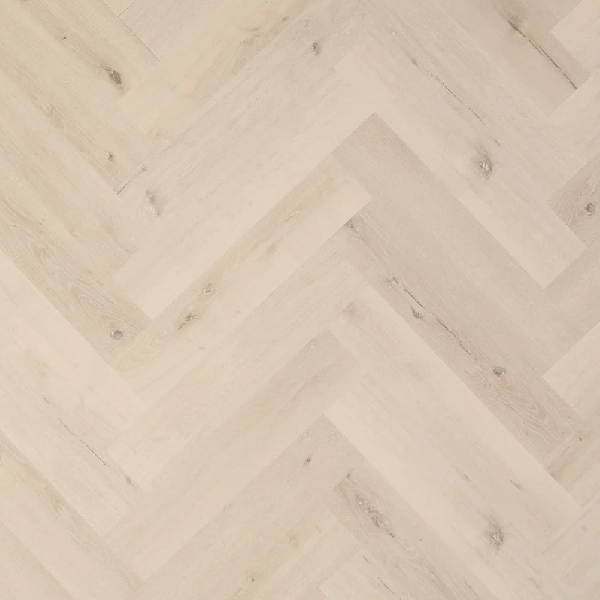 whitewashed wood-effect LVT flooring in a herringbone pattern