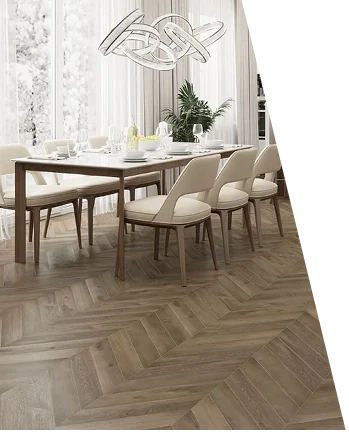 Brown wood chevron parquet flooring in a bright dining room