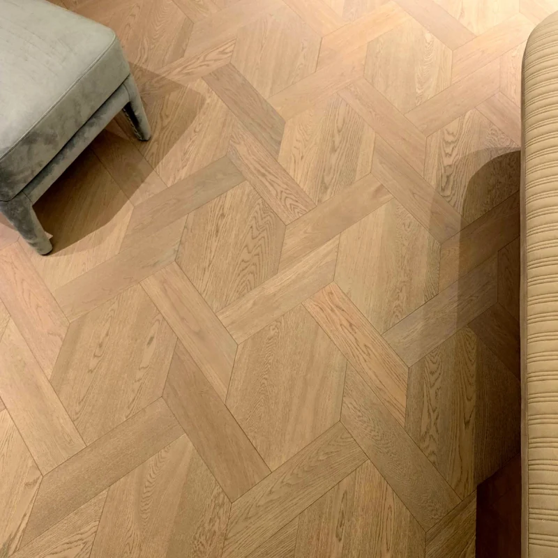 Close-up of a complex Mansion Weave pattern in light oak parquet flooring.
