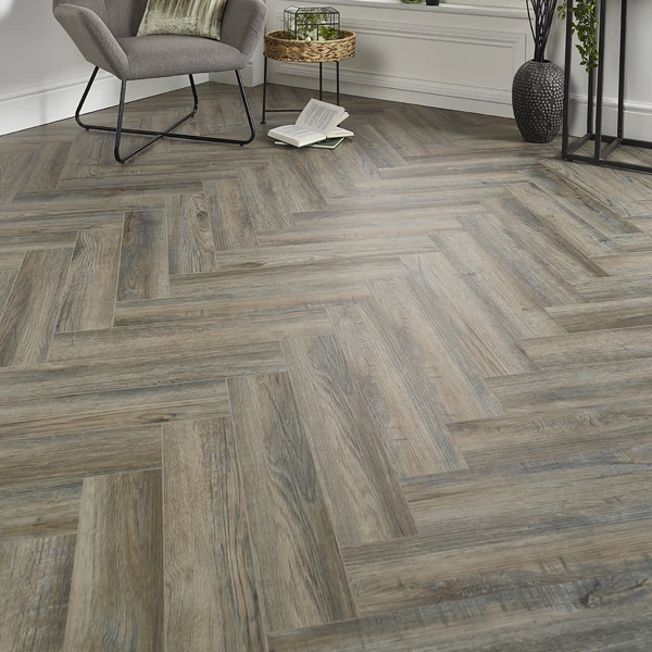 Cozy room corner featuring weathered grey chevron vinyl flooring