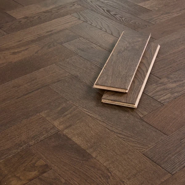 Dark brown engineered parquet flooring planks
