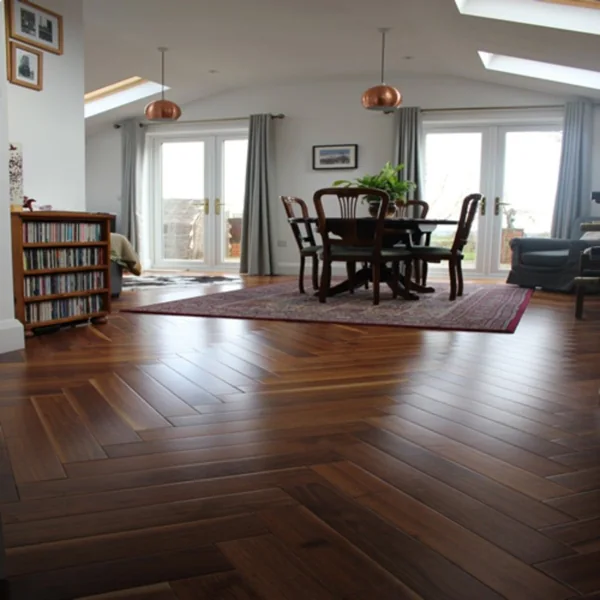 Dark oiled oak herringbone parquet flooring in a spacious room