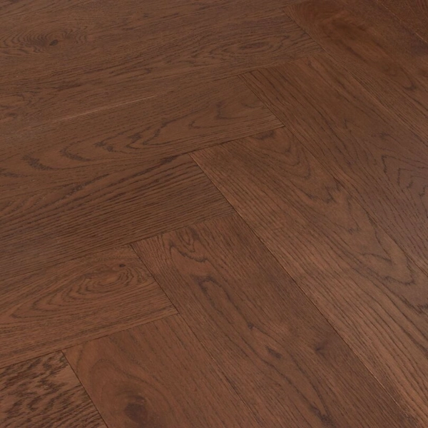Finished dark oak wood floor in a classic herringbone pattern