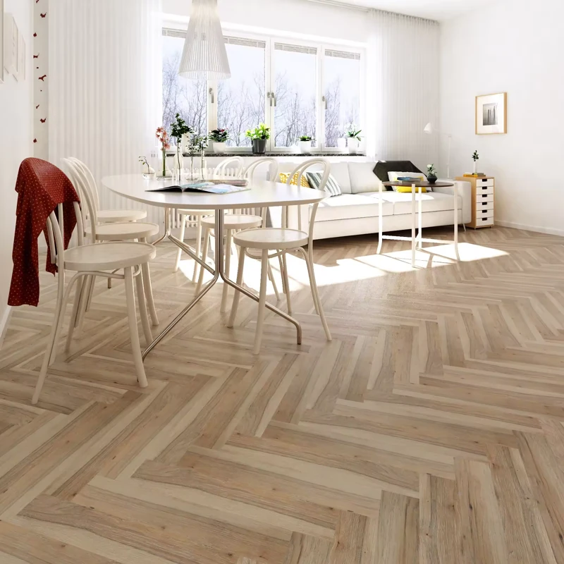 Light oak chevron laminate flooring in a bright dining room.
