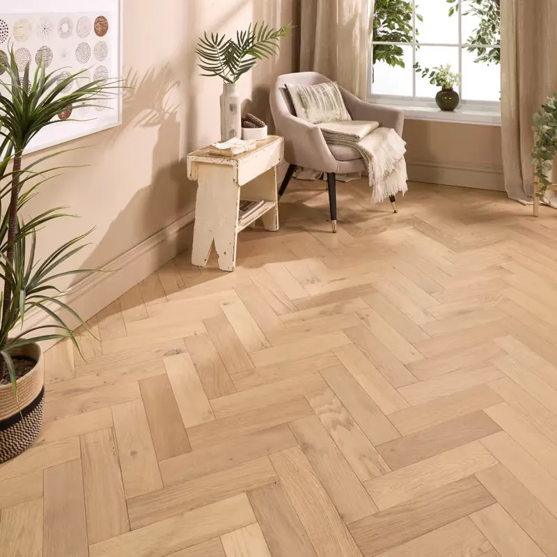 Light oak engineered parquet flooring laid in a herringbone pattern