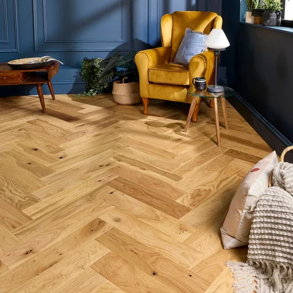 Living room interior featuring natural oak herringbone engineered parquet flooring