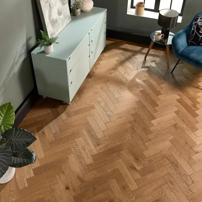 Medium oak engineered parquet flooring laid in a herringbone pattern