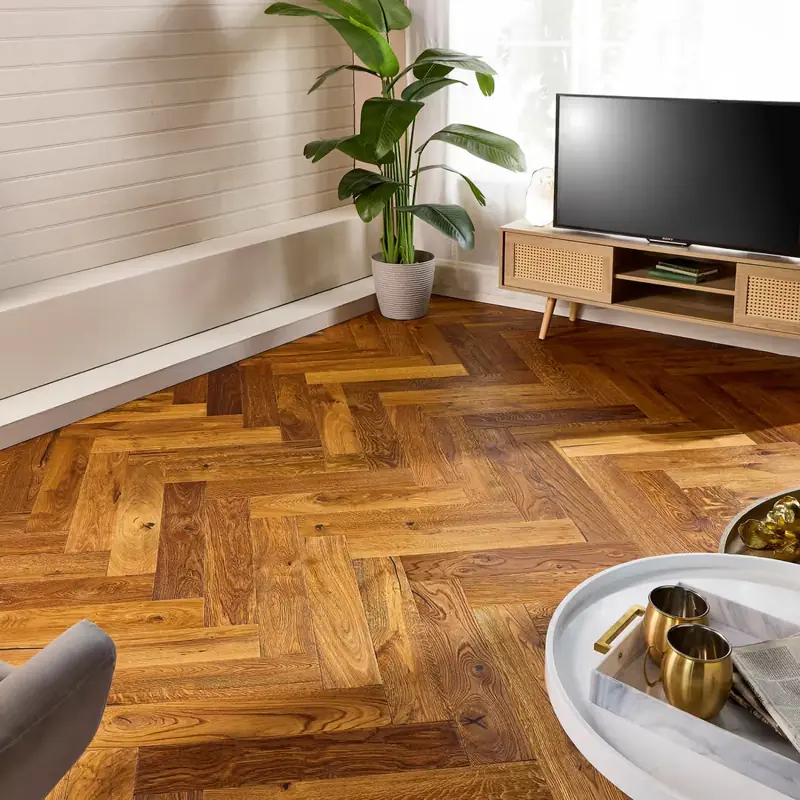 Rich, multicolored engineered parquet flooring laid in a herringbone pattern