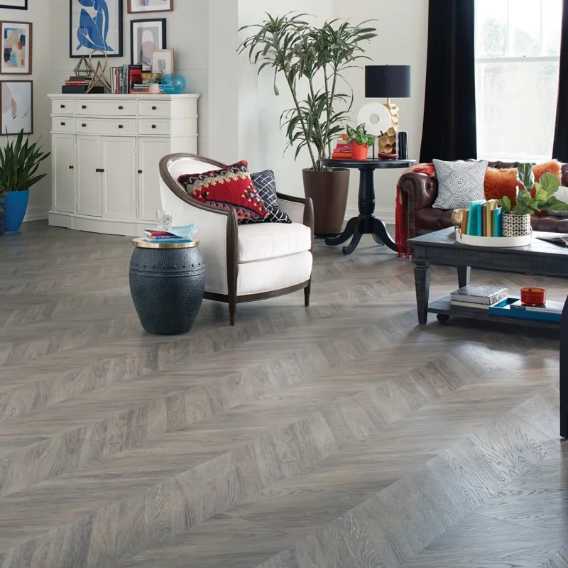 Waterproof chevron parquet flooring in a stylish eclectic living room interior
