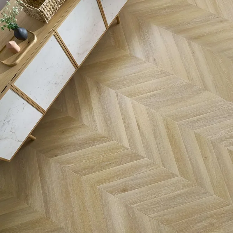 Waterproof chevron parquet flooring next to a modern side cabinet